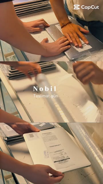 Nobil Bilişim atölyesinde onarımı biten notebook'ların teslim için streç filmle paketlenmesi